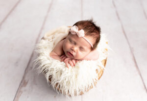 newborn in a basket